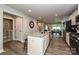 Spacious kitchen featuring a large island, stainless steel appliances, and an open view to the dining area at 124 Kristin View Ln # Townhome A, Troutman, NC 28166