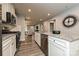 Well-lit kitchen featuring granite countertops, stainless steel appliances, and an open layout at 124 Kristin View Ln # Townhome A, Troutman, NC 28166