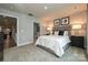 Neutral main bedroom with a view of a bathroom, and a plush carpet at 124 Kristin View Ln # Townhome A, Troutman, NC 28166