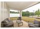 Covered patio area with comfortable seating, perfect for outdoor relaxation and entertainment at 124 Kristin View Ln # Townhome A, Troutman, NC 28166