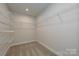 Walk-in closet with carpet and shelving for ample storage space at 124 Kristin View Ln # Townhome A, Troutman, NC 28166