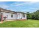 Exterior view of back patio, yard, grill, and vinyl siding home at 130 24Th Nw St, Hickory, NC 28601
