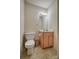 Cozy half bathroom with modern vanity, stylish mirror, and standard toilet at 130 24Th Nw St, Hickory, NC 28601