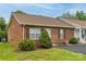 Charming brick townhouse with manicured landscaping and a well-maintained front yard at 130 24Th Nw St, Hickory, NC 28601