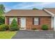 Charming brick townhouse with manicured landscaping and a well-maintained front yard at 130 24Th Nw St, Hickory, NC 28601