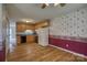 Classic kitchen with wood cabinets, black appliances, and adjacent dining area at 130 24Th Nw St, Hickory, NC 28601