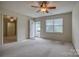 Bright living room featuring neutral carpet, ceiling fan, and ample natural light at 130 24Th Nw St, Hickory, NC 28601