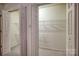 Spacious walk-in closet with ample shelving and well-lit interior at 130 24Th Nw St, Hickory, NC 28601