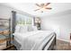Comfortable bedroom with neutral decor, window for natural light and ceiling fan at 138 Chase Water Dr, Mooresville, NC 28117