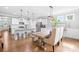 Well-lit kitchen with white cabinets, granite countertops, stainless steel appliances, and pendant lighting at 138 Chase Water Dr, Mooresville, NC 28117