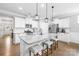 Gourmet kitchen with granite counters, stainless steel appliances, white cabinetry, and modern pendant lights at 138 Chase Water Dr, Mooresville, NC 28117