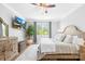 Spacious main bedroom featuring a ceiling fan, television, hardwood floors, and ample natural light at 138 Chase Water Dr, Mooresville, NC 28117