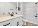 Bathroom featuring modern fixtures, vanity with a quartz countertop, and tub with shower at 1420 Tyler St, Kannapolis, NC 28083