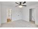 Large bedroom featuring neutral carpet, a ceiling fan, ensuite bathroom and closets at 1420 Tyler St, Kannapolis, NC 28083