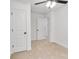 Bright bedroom featuring neutral carpet, a ceiling fan, and ample closet space at 1420 Tyler St, Kannapolis, NC 28083