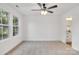 Large bedroom featuring verdant views, neutral carpet, and ensuite bathroom at 1420 Tyler St, Kannapolis, NC 28083