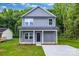 Charming two-story home features a well-maintained lawn, covered porch and inviting curb appeal at 1420 Tyler St, Kannapolis, NC 28083