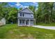 Two-story home with gray siding, lush lawn and landscaping at 1420 Tyler St, Kannapolis, NC 28083