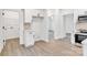 Bright kitchen features white cabinets, stainless steel appliances, and a sleek backsplash at 1420 Tyler St, Kannapolis, NC 28083