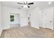 Bright living room featuring sleek flooring, neutral walls, and a contemporary ceiling fan at 1420 Tyler St, Kannapolis, NC 28083