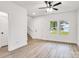 Inviting living area with natural light, wood-look flooring, and staircase access at 1420 Tyler St, Kannapolis, NC 28083