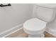 Close-up of a standard white toilet with a minimalist design, complemented by a modern bathroom at 1420 Tyler St, Kannapolis, NC 28083
