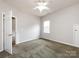 Bedroom features light-colored walls, carpet, closet and ceiling fan at 1423 Piper Ct, Concord, NC 28025