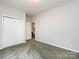 Bedroom with closet, neutral walls, and access to staircase at 1423 Piper Ct, Concord, NC 28025