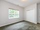 Comfortable bedroom with a window and a closet, perfect for a relaxing retreat at 1423 Piper Ct, Concord, NC 28025