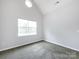 Bright, airy bedroom with vaulted ceiling and large window at 1423 Piper Ct, Concord, NC 28025
