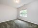 Cozy bedroom featuring a window allowing natural light to illuminate the room at 1423 Piper Ct, Concord, NC 28025