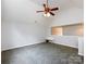 Spacious bonus room with high ceilings, ceiling fan, and natural light at 1423 Piper Ct, Concord, NC 28025
