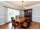 Formal dining room with large window, classic furniture, and ample natural light at 1423 Piper Ct, Concord, NC 28025