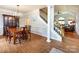 Elegant dining room with hardwood floors, chandelier, and stairs to the upper floor at 1423 Piper Ct, Concord, NC 28025