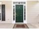 Classic front door with sidelights and transom window, situated on a welcoming covered porch at 1423 Piper Ct, Concord, NC 28025
