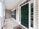 Inviting front door framed by sidelights and pillars, leading to a covered porch at 1423 Piper Ct, Concord, NC 28025