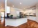 Kitchen island with granite countertops and stainless steel appliances at 1423 Piper Ct, Concord, NC 28025