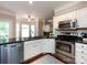 Bright kitchen with stainless appliances and lots of natural light at 1423 Piper Ct, Concord, NC 28025