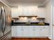 Bright kitchen with white cabinets and tile backsplash at 1423 Piper Ct, Concord, NC 28025