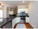 Modern kitchen with stainless appliances and hardwood floors at 1423 Piper Ct, Concord, NC 28025