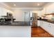Bright kitchen features stainless appliances, white cabinetry, and granite countertops at 1423 Piper Ct, Concord, NC 28025