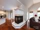 Cozy living room featuring a fireplace and access to the kitchen at 1423 Piper Ct, Concord, NC 28025