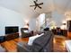Comfortable living room with hardwood floors, vaulted ceiling, and easy access to the staircase at 1423 Piper Ct, Concord, NC 28025