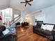Spacious living room with hardwood floors, fireplace, and vaulted ceilings at 1423 Piper Ct, Concord, NC 28025