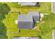 Aerial view of the home showcasing the roof, lawn, driveway, and mature trees at 1515 Kingdom Way, Fort Mill, SC 29707