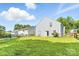 A spacious backyard features green grass and a house with light blue siding at 1515 Kingdom Way, Fort Mill, SC 29707