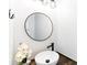 Stylish half bath features a modern vessel sink, dark wood counter, and decorative mirror at 1515 Kingdom Way, Fort Mill, SC 29707