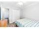 Bright bedroom boasts wood-look flooring, ceiling fan, closet, and neutral color scheme at 1515 Kingdom Way, Fort Mill, SC 29707
