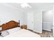 Bedroom features wood-look flooring, neutral walls, and ceiling fan, and a light-filled closet at 1515 Kingdom Way, Fort Mill, SC 29707