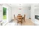 Well-lit dining area with a round table, four chairs, and a sliding glass door that provides natural light at 1515 Kingdom Way, Fort Mill, SC 29707